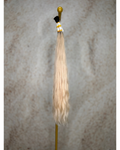 Four bundles of medium blond with dark roots body wavy bulk hair arranged together.